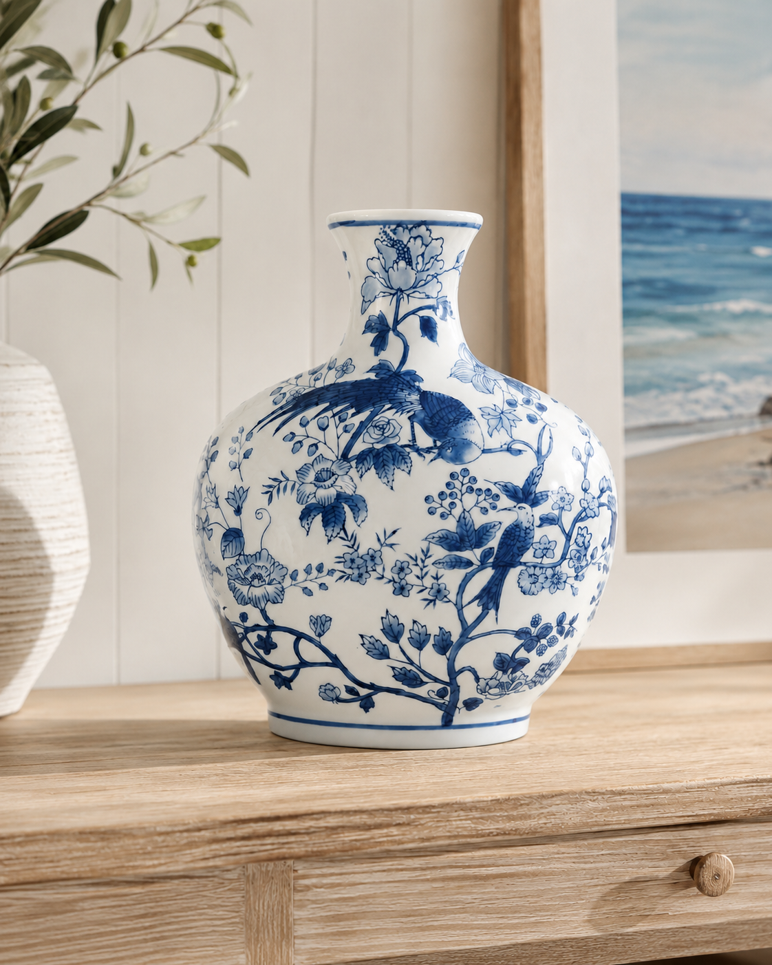 Blue and white ceramic vase and ginger jar set styled on a timber console in a coastal home