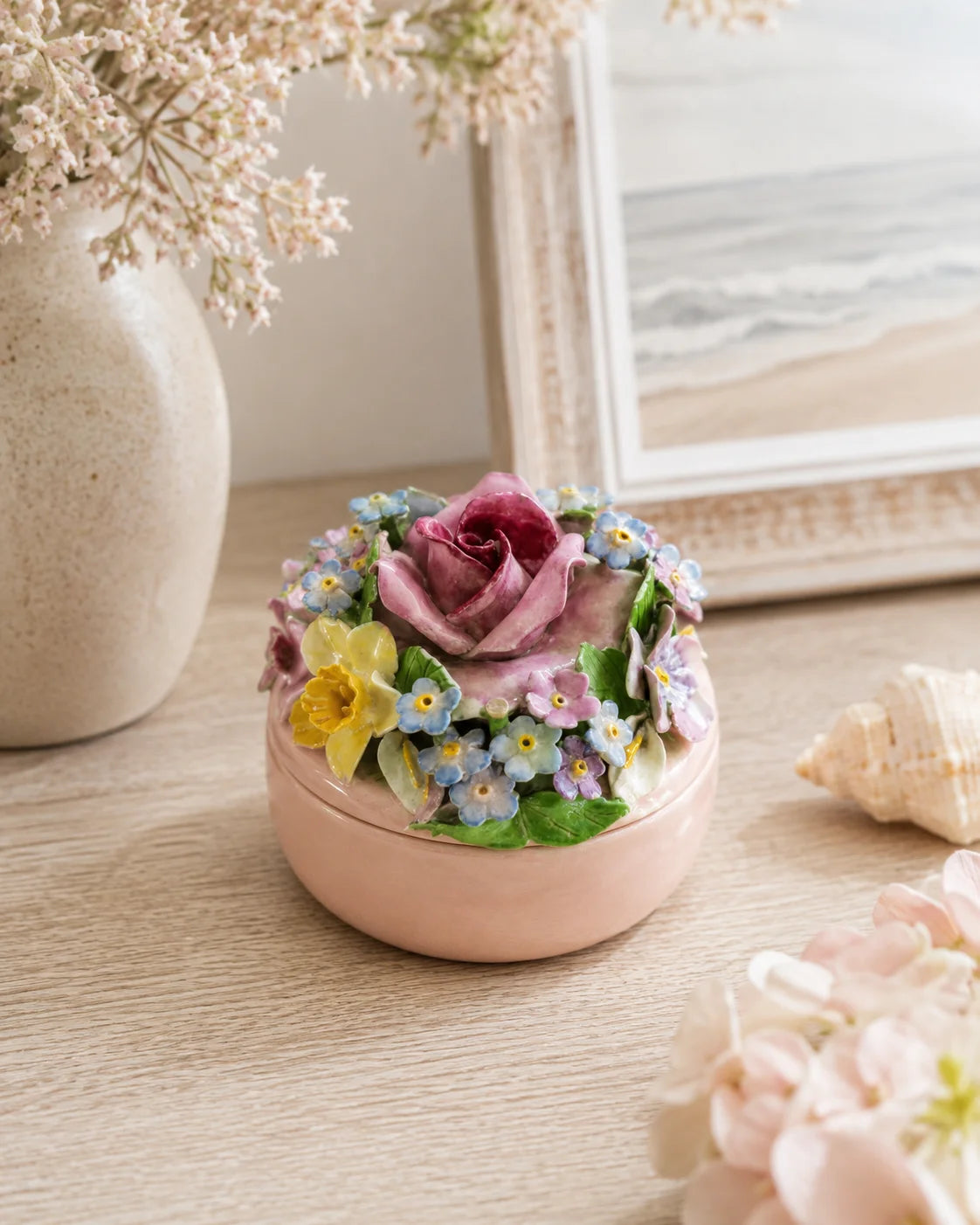 Blush pink ceramic floral keepsake jar with sculpted rose and raised pastel flowers