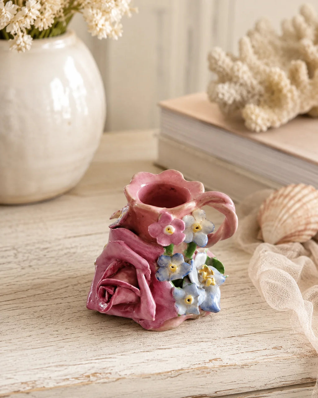 Vintage blush pink mini floral vase styled on a light timber console