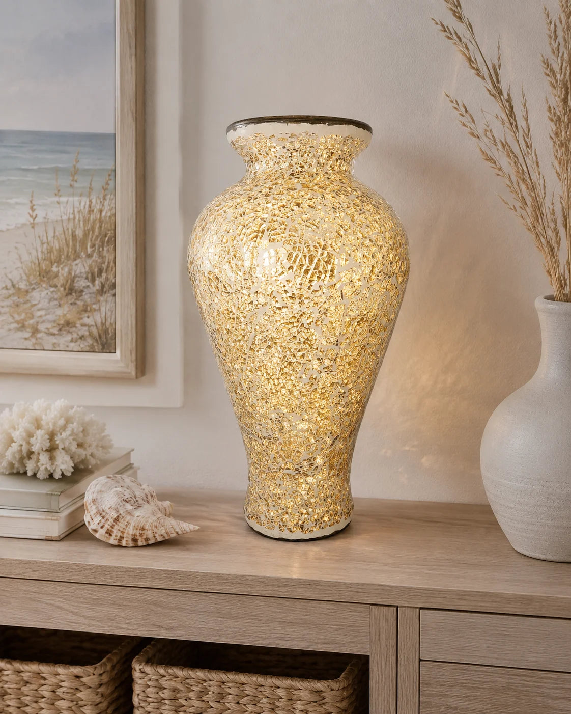 Close-up of Sunlit Coast gold mosaic vase with reflective sun-like detailing